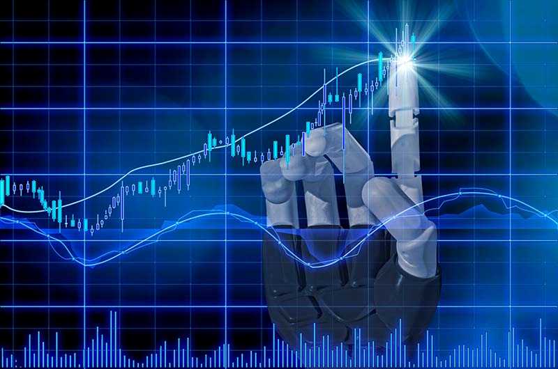 En bild på en robothand som rör aktiemarknaden.