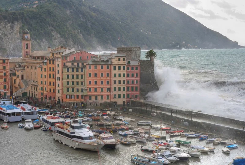Picture of a large wave breaking on a breakwater.